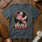 Heals Different - T‑Shirt