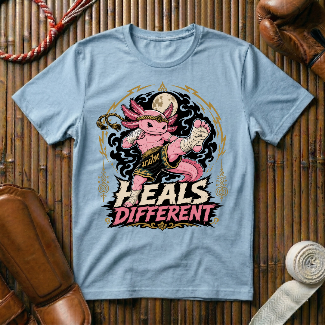 Heals Different - T‑Shirt
